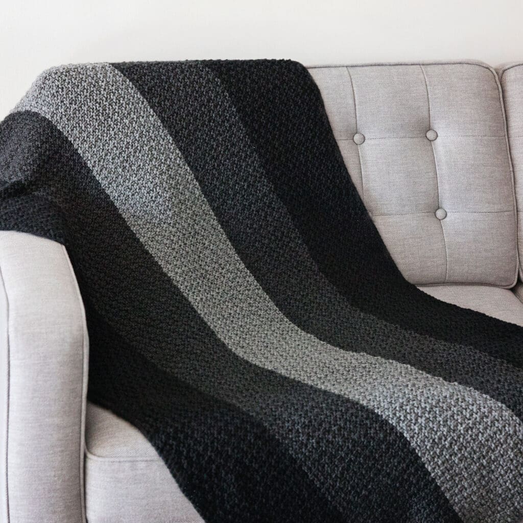 Faded Blanket On Sofa