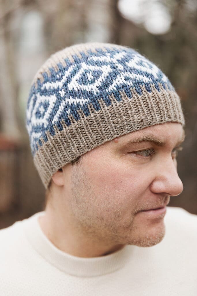 Man looking to the side wearing knit beanie for free pattern