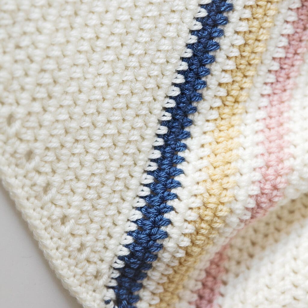 Corner to Corner Crochet Baby Blanket with Strips Close up 